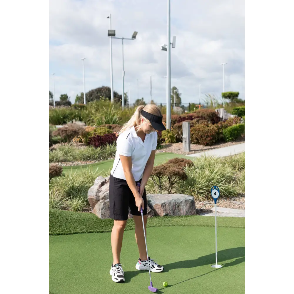 Black "Maggie Short" for women, featuring a flat front with drawstring, elastic back, side pockets, and split cuffs, designed for a relaxed, comfortable fit just above the knee.