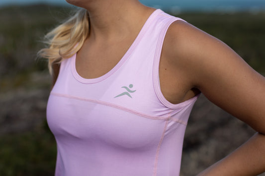 Baby Pink Super Comfortable Sports Singlets feature a lightweight, looser fit so that you can stay comfortable during your workoutby pink 