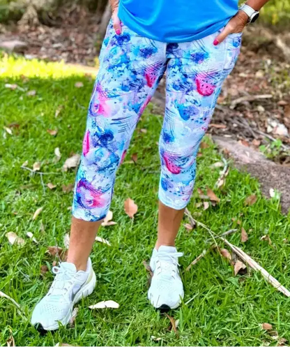 Amelia 3/4 active leggings in vibrant blue and pink fish pattern feature moisture wicking fabric for activewear use