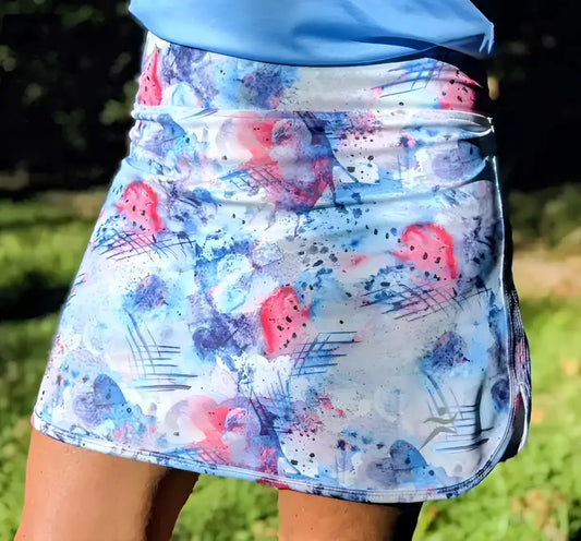 Amelia skort with pockets in vibrant pink blue and white floral watercolor design with athletic cut for golf pickleball and trail running