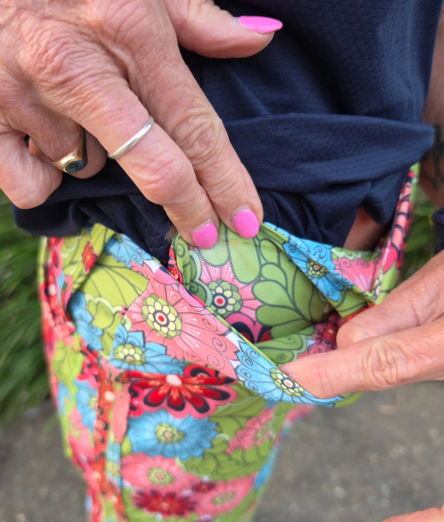 Cara longer skort with pockets in vibrant green pink and blue floral patterned fabric for casual wear