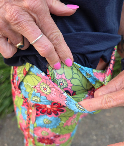 Cara longer skort with pockets in vibrant green pink and blue floral patterned fabric for casual wear