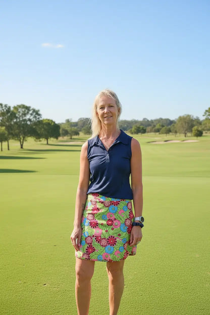 Cara longer skort with pockets featuring a vibrant green pink and blue floral pattern in lightweight fabric