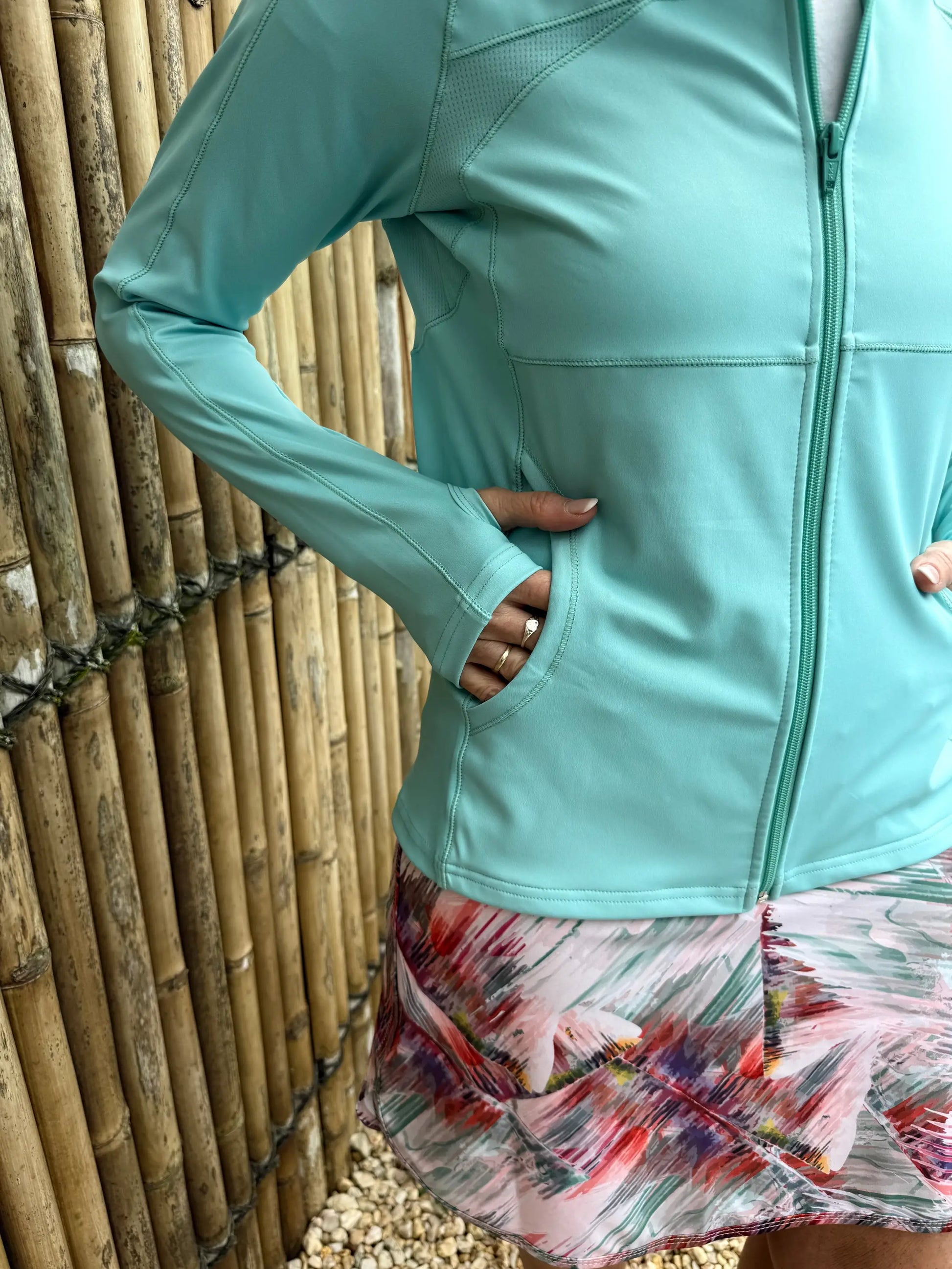 Emma sports jacket in light teal features a form-fitting design with mesh paneling for athletic use in sizes XS to 3XL