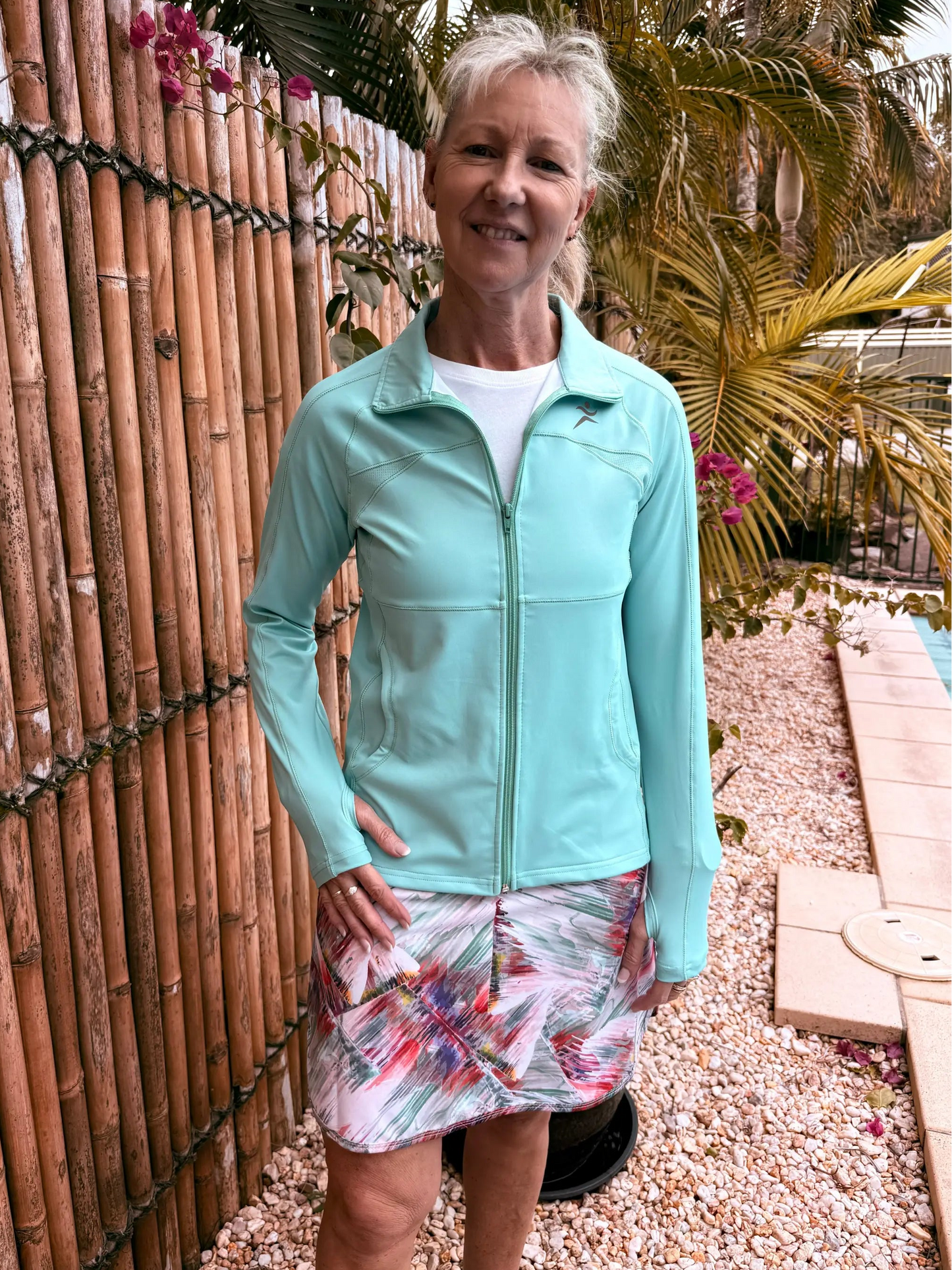 Mint green emma sports jacket with zip-up front and subtle logo on left chest available in xs to 3xl sizes