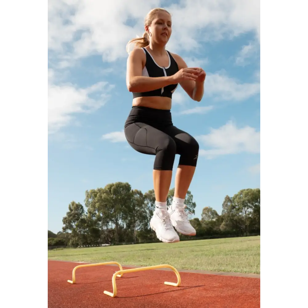 Gmaxx 'ATTACK Black Active 3/4 Leggings - A sleek, 3/4 black high-performance legging designed for all physical activities. It features two large side pockets and a small fob/coin pocket for secure storage.