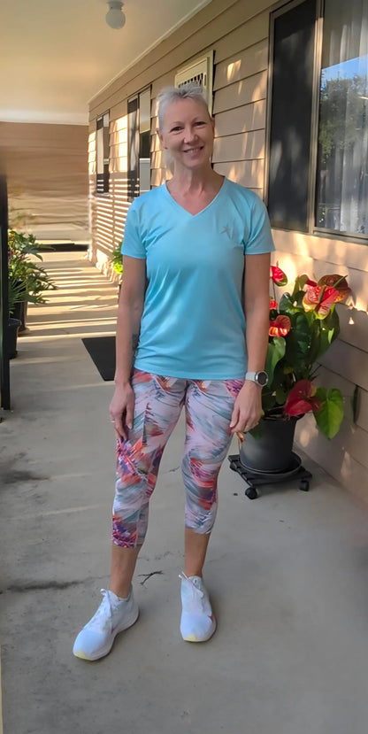 Light blue gmaxx mesh lightweight v-neck activewear top with small chest logo in sizes XS to 3XL