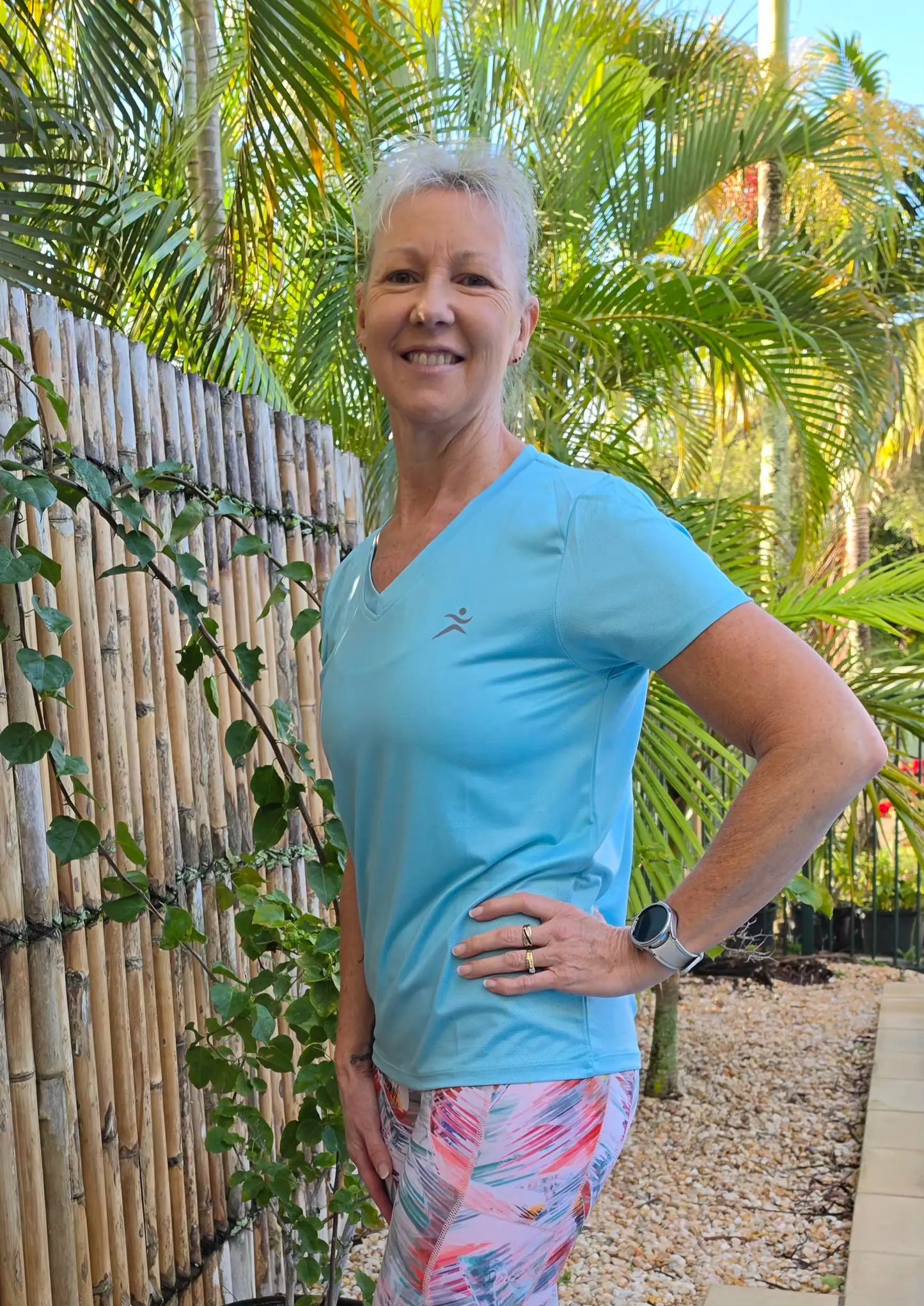 Light blue gmaxx mesh tee with short sleeves and small chest logo lightweight v-neck activewear top