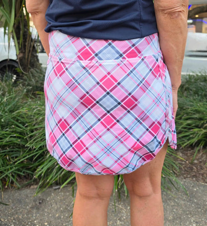 Pink and white plaid Harper skort with wrap-around design and pockets perfect for golf or casual wear