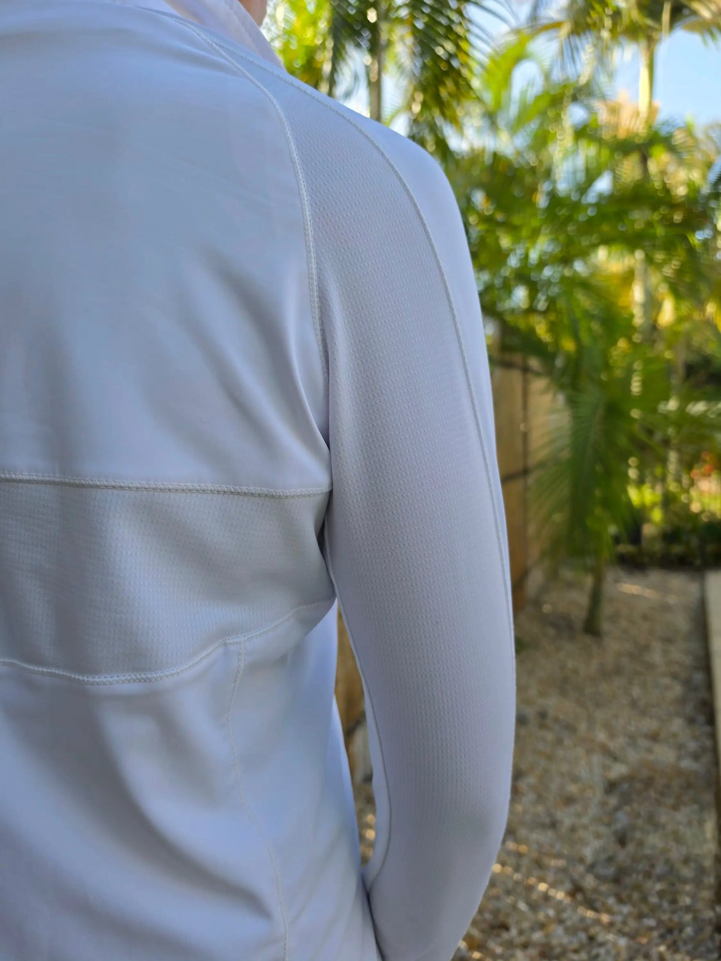 Hayley white sports jacket with breathable textured fabric and subtle seam detailing in white long-sleeved athletic style