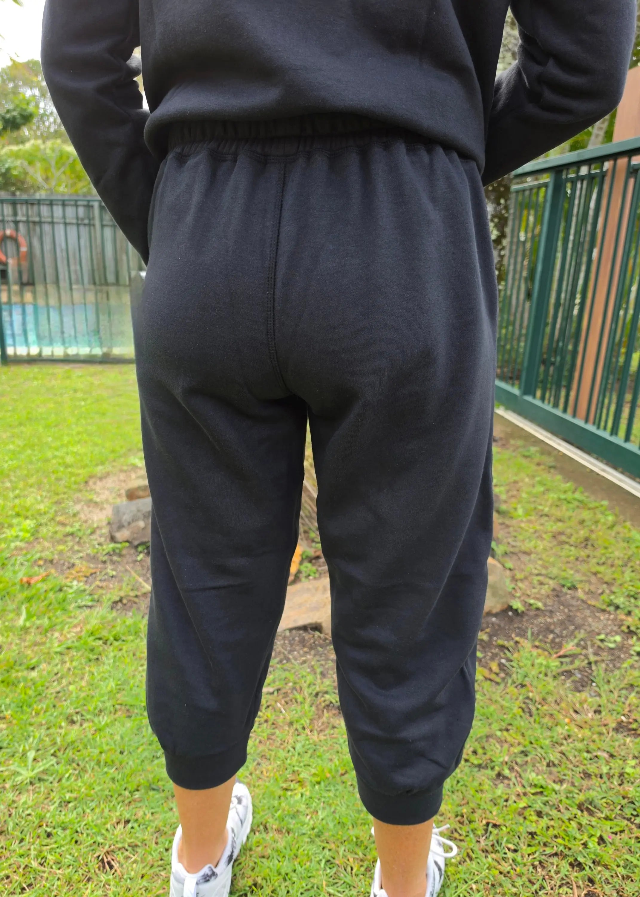 Black fleecy pant kozy 3/4 fleecy pants with elastic waist cuffed hems and pockets ideal for cool days winter wardrobe winner
