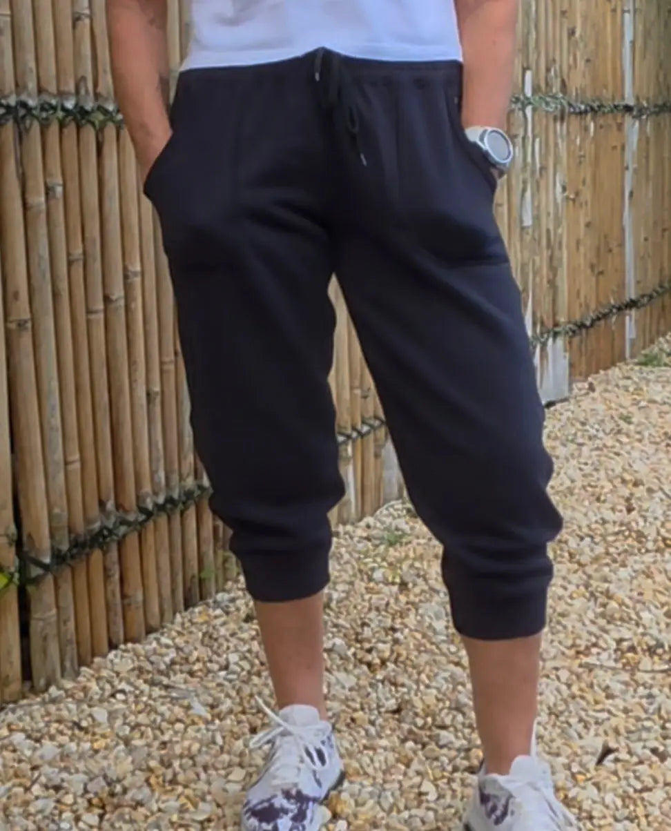 Black cropped kozy 3/4 fleecy pant with elastic waistband and pockets made of soft cotton blend for cool days winter wardrobe