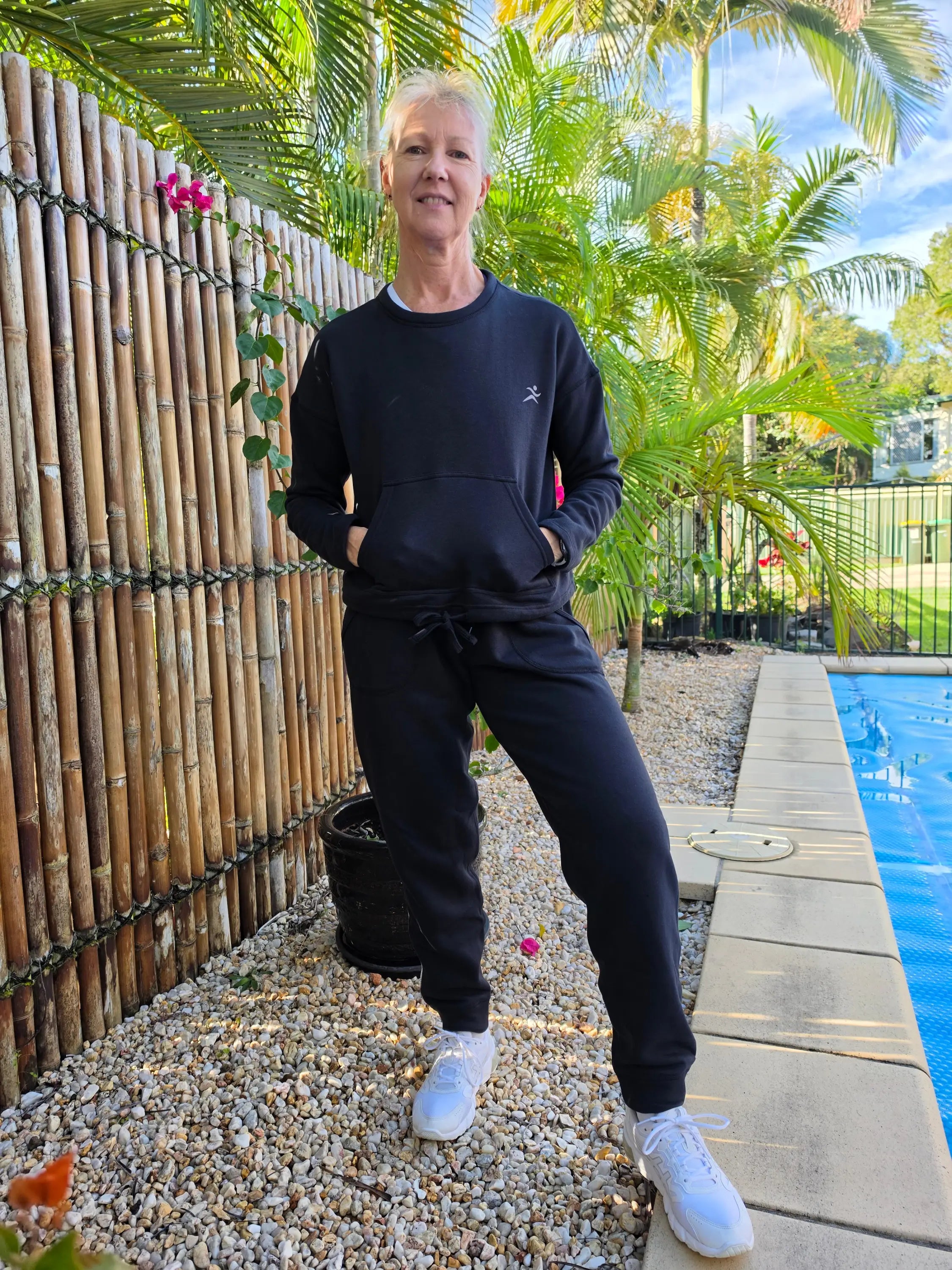 Black kozy fleecy sweatshirts with small white logo paired with matching fleecy pant winter wardrobe winner