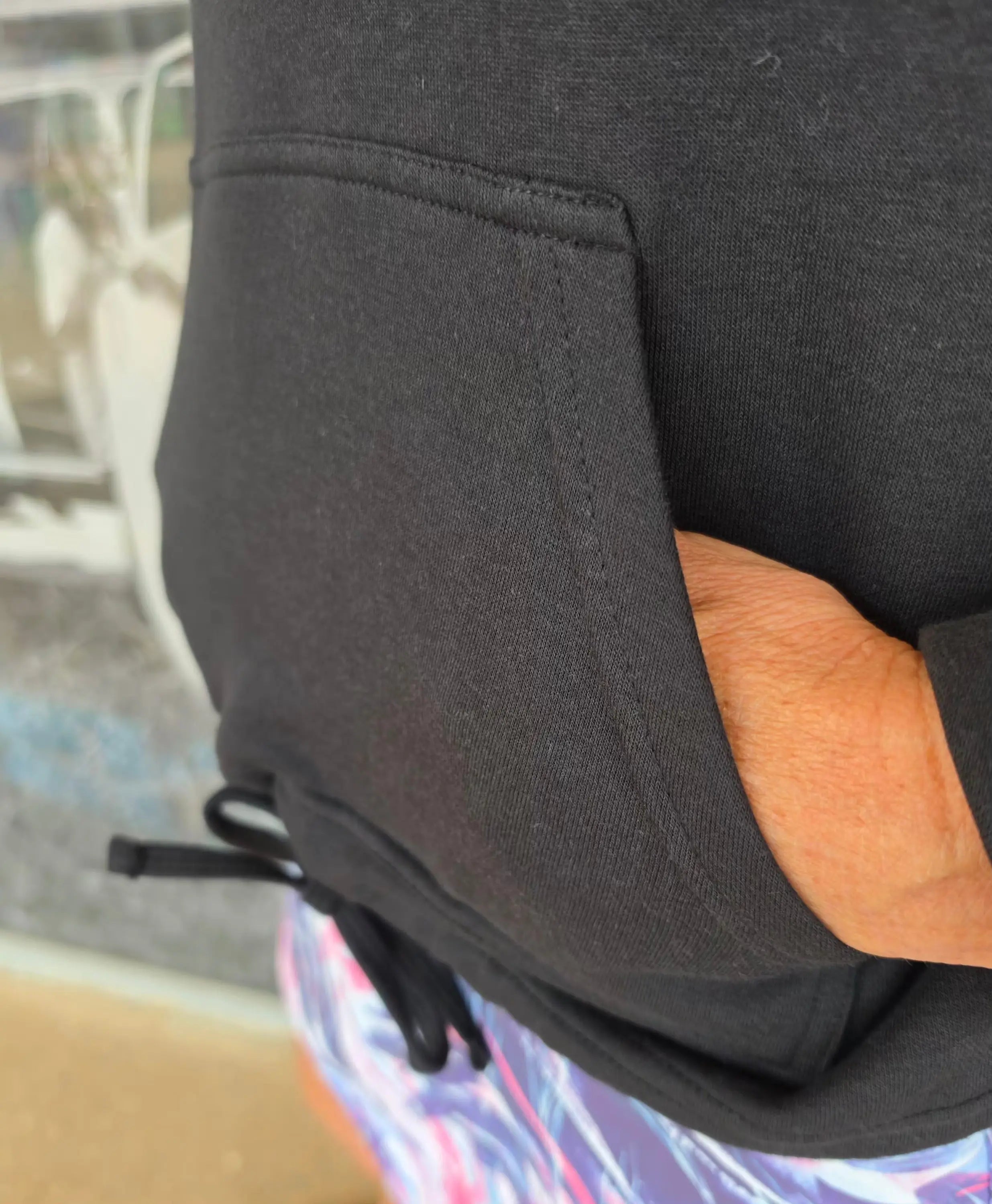 Black kozy fleecy top activewear hoodie with front pocket drawstring waistband made of cotton polyester blend