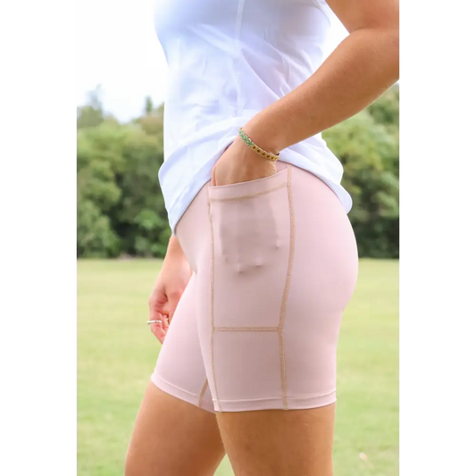 The 'Latte' Active Bike Short is a firm high rise active short designed to firmly hug the body. These mid thigh length shorts feature flat lock stitching for the ultimate comfort plus a wide stretch comfy waistband that features a drawstring for the perfect fit. Moisture wicking fabric treatment to keep you cool and dry.