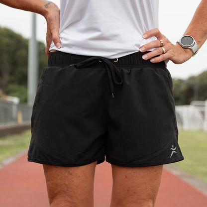 Lightweight running shorts featuring breathable mesh briefs for comfort, two convenient side pockets, and an adjustable drawstring waist.