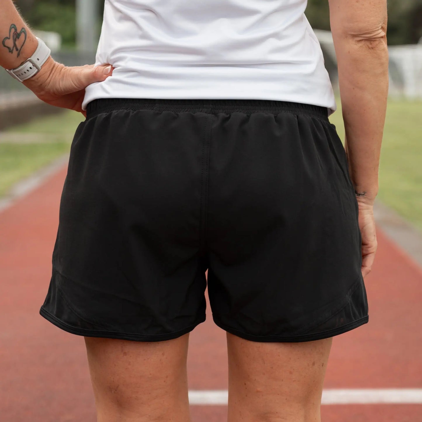 Lightweight running shorts featuring breathable mesh briefs for comfort, two convenient side pockets, and an adjustable drawstring waist.