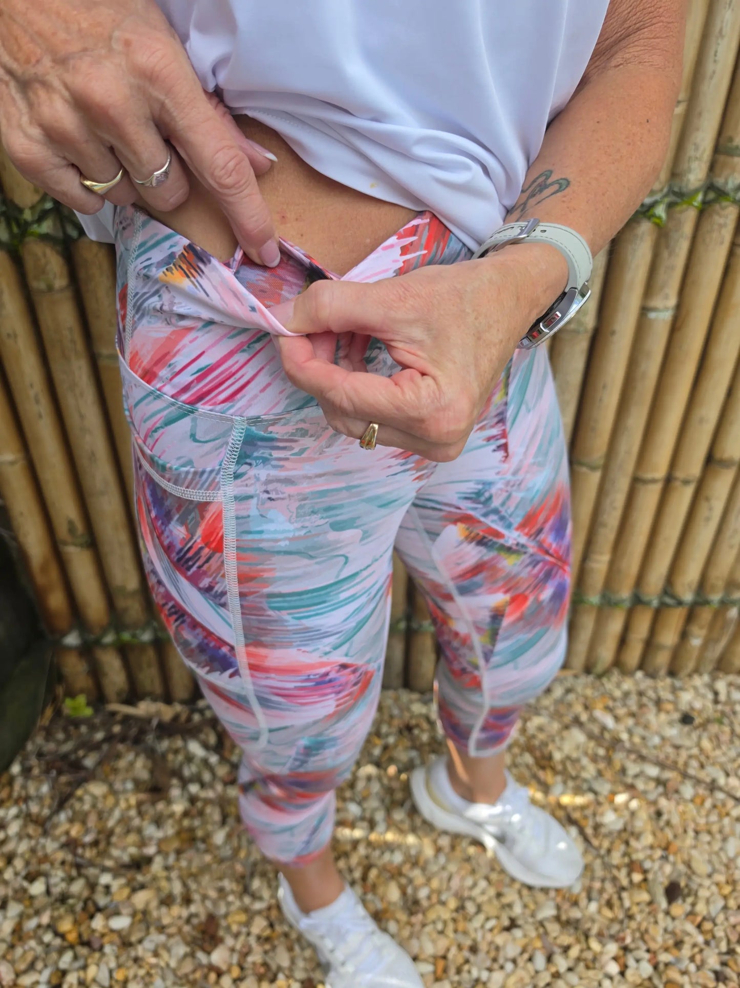 Toni 3/4 active leggings with colorful tropical leaf pattern in moisture wicking stretchy athletic fabric for activewear