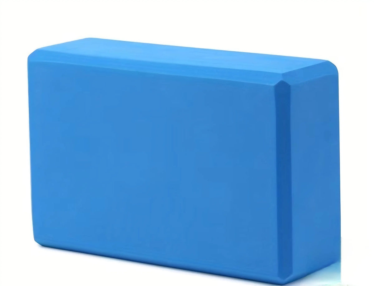 Solid blue rectangular foam yoga block with smooth matte finish for support in activewear workouts