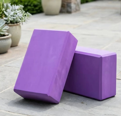 Purple yoga blocks with a smooth matte finish made of foam blocks for enhanced support in activewear routines