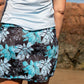 Gmaxx Bonnie Skort in vibrant blues florals on a black background. Built in undershorts have 2 pockets
