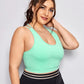 Criss Cross Medium Support Crop Top with a bright green color and a classic scoop neck, it's the perfect balance of secured support and daring style.