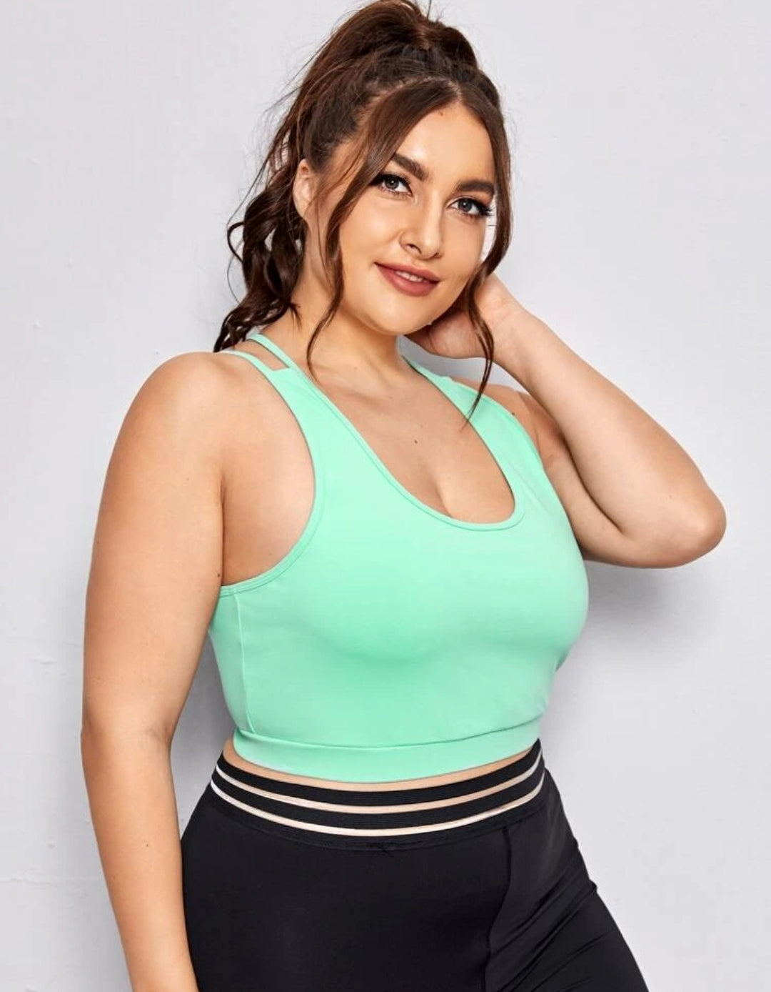 Criss Cross Medium Support Crop Top with a bright green color and a classic scoop neck, it's the perfect balance of secured support and daring style.